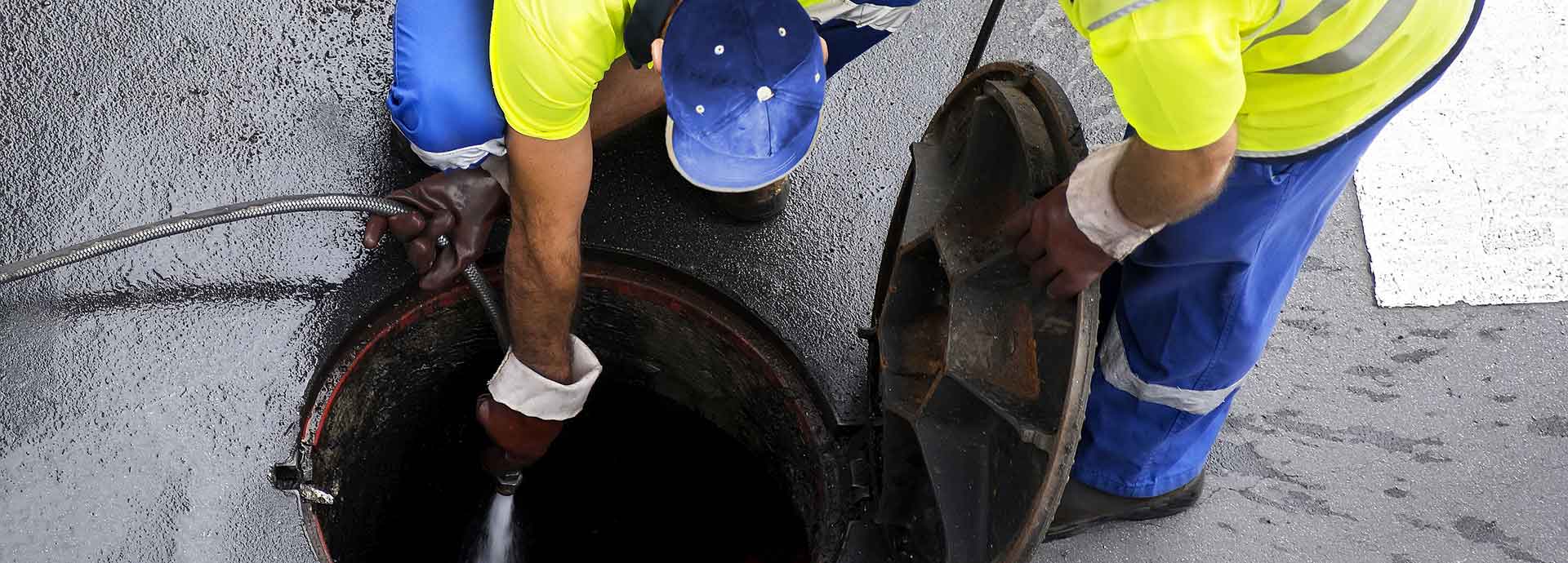 drainage engineer hard at work clearing a drain